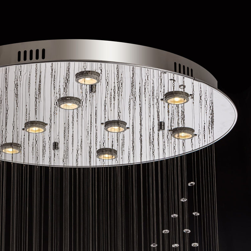 Close-up of modern spiral crystal chandelier showing three sphere raindrop design details | Feyran