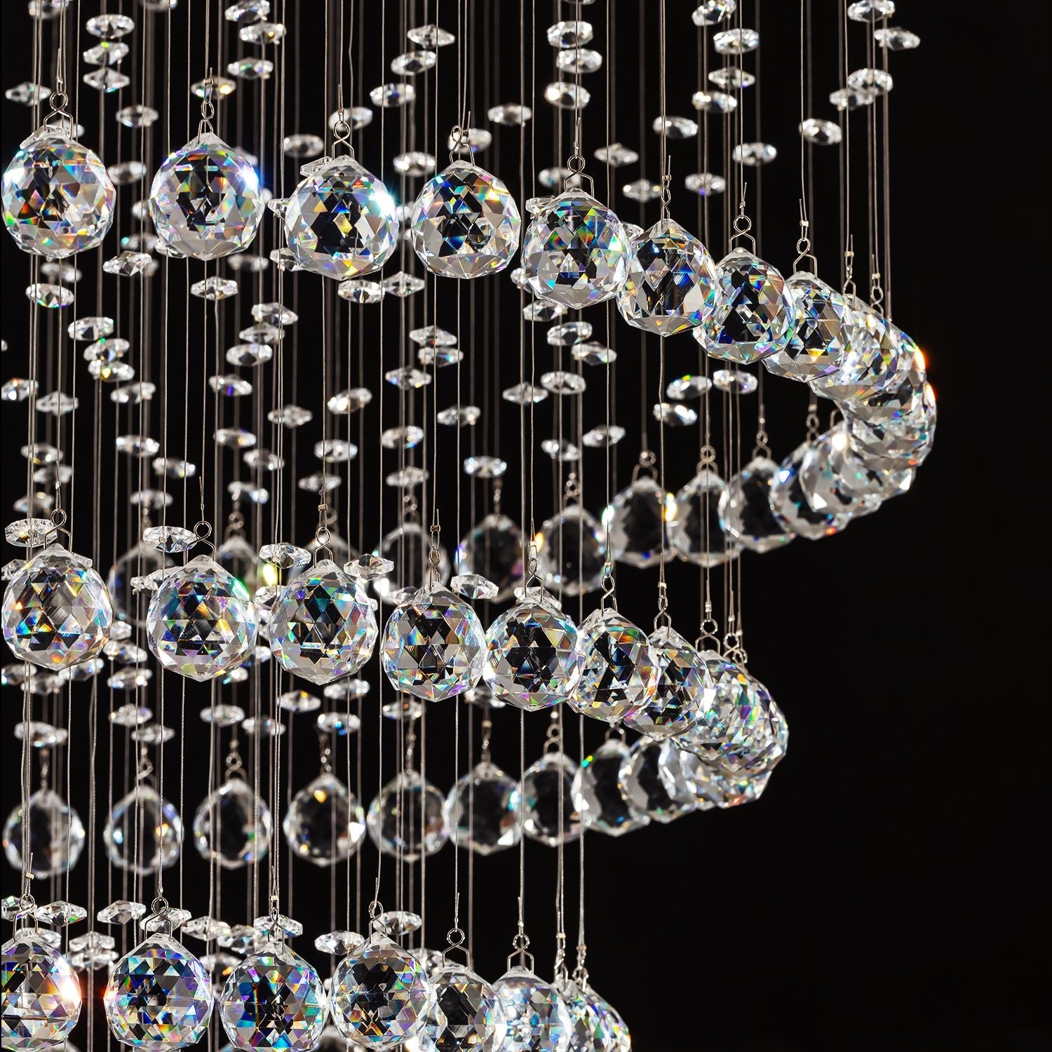 close up detail of faceted crystal balls used in luxury modern round crystal chandelier lighting fixture | Feyran