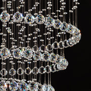 close up detail of faceted crystal balls used in luxury modern round crystal chandelier lighting fixture | Feyran