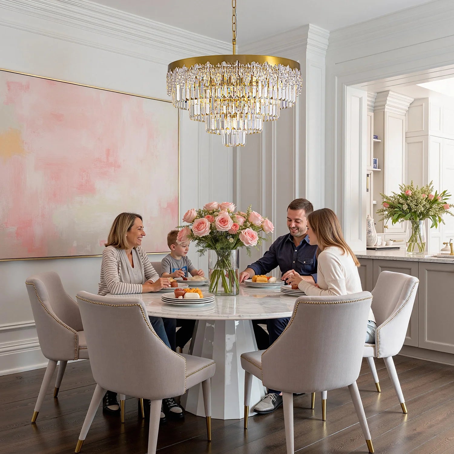lumina-gold-crystal-tiered-chandelier-hanging-above-a-dining-table-Feyran-lighting