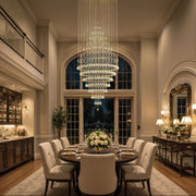 modern round crystal chandelier lighting fixture above dining table in elegant dining room | Feyran