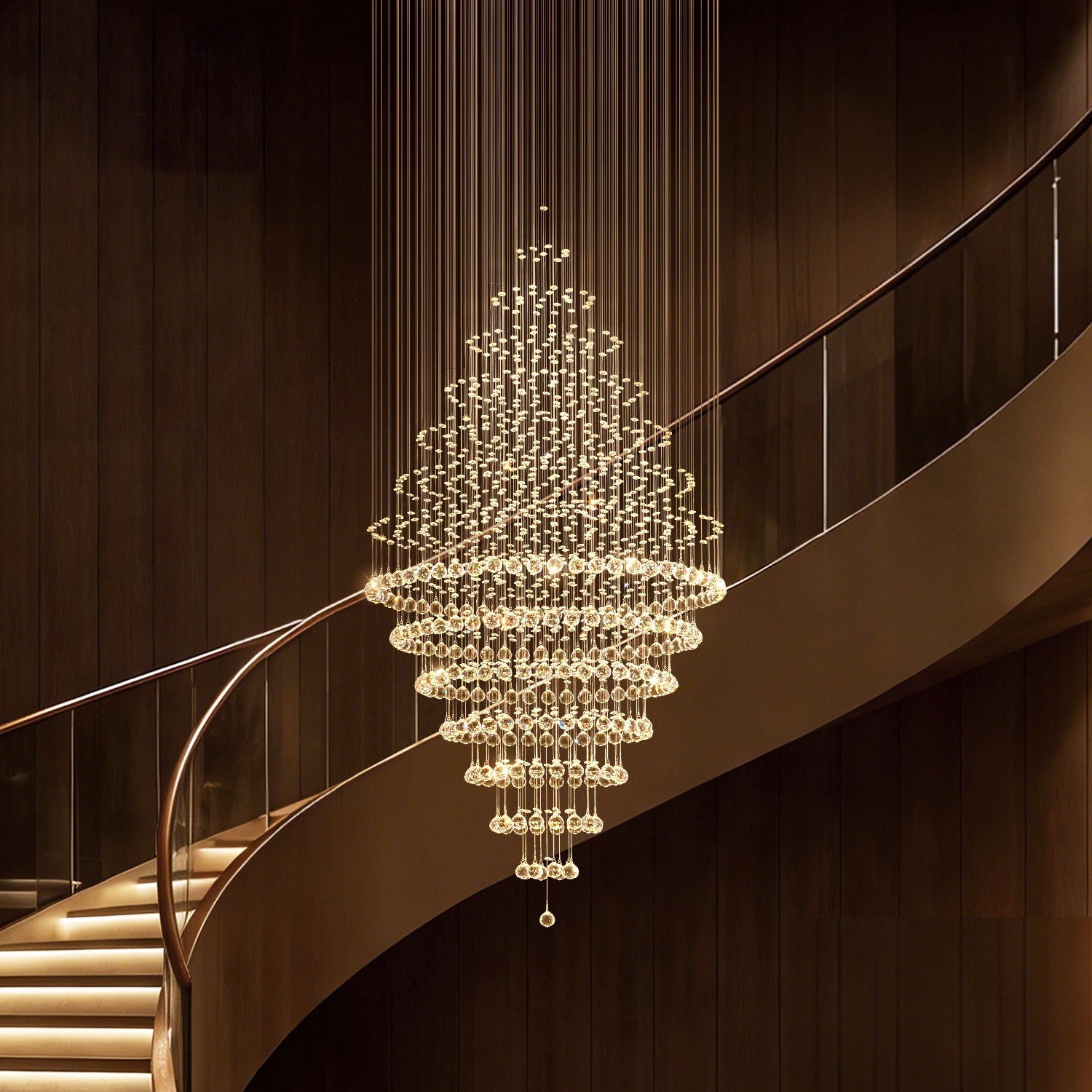 luxury modern round crystal chandelier staircase lighting fixture with spiral crystal strands hanging over curved staircase | Feyran