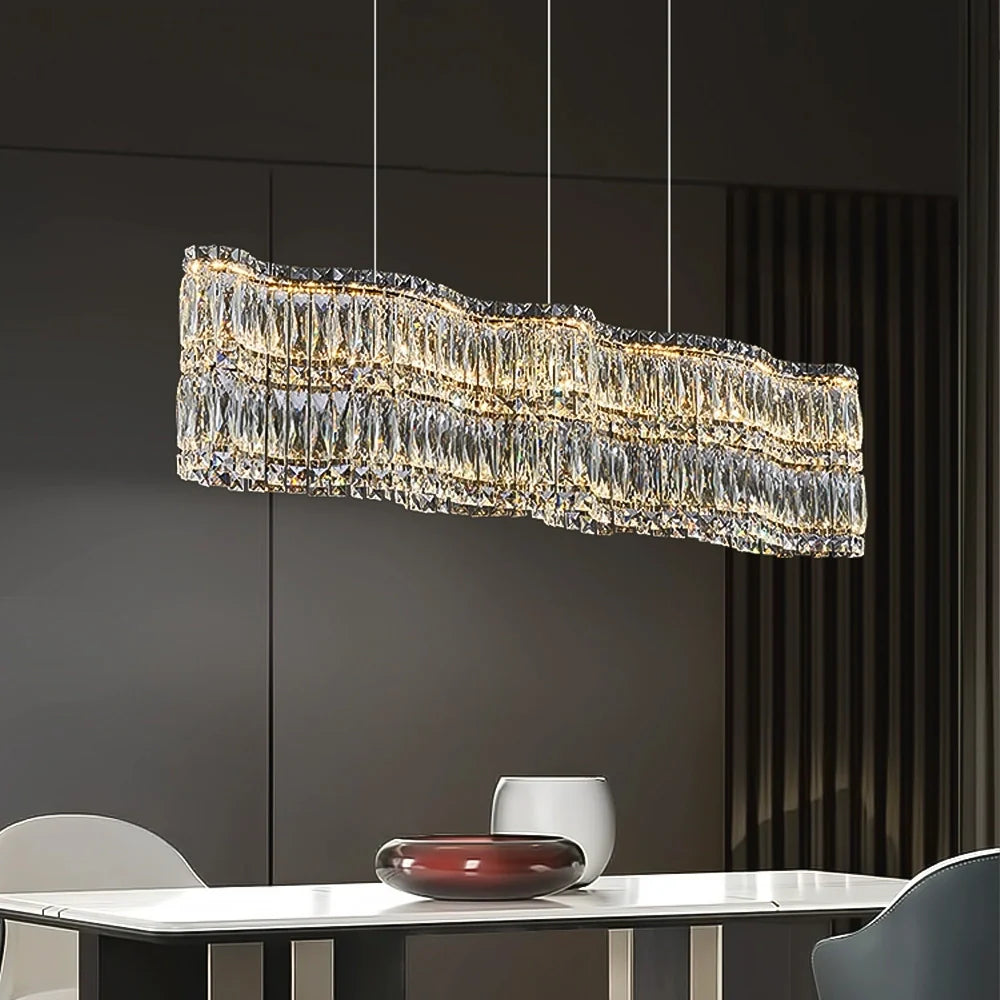 luxury-wave-crystal-linear-chandelier-above-a-dining-table-ch406-20250619-Feyran-lighting