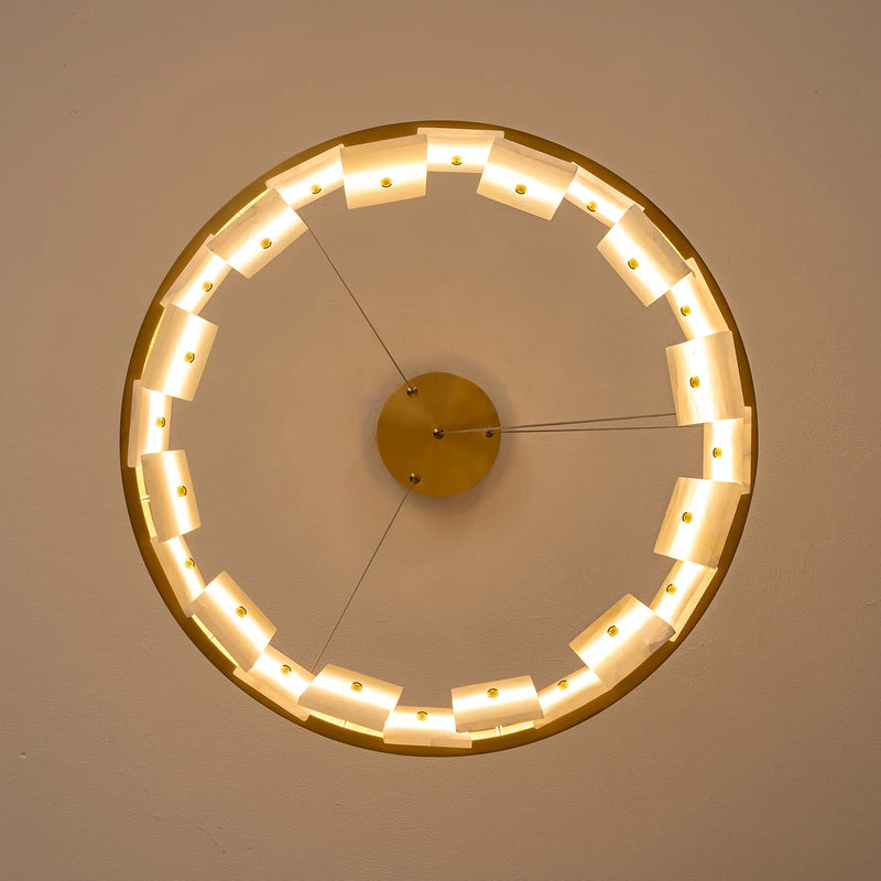 underside-view-modern-round-alabaster-gold-chandelier-with-circular-gold-frame-and-evenly-spaced-alabaster-panels-emitting-warm-light-Feyran-lighting