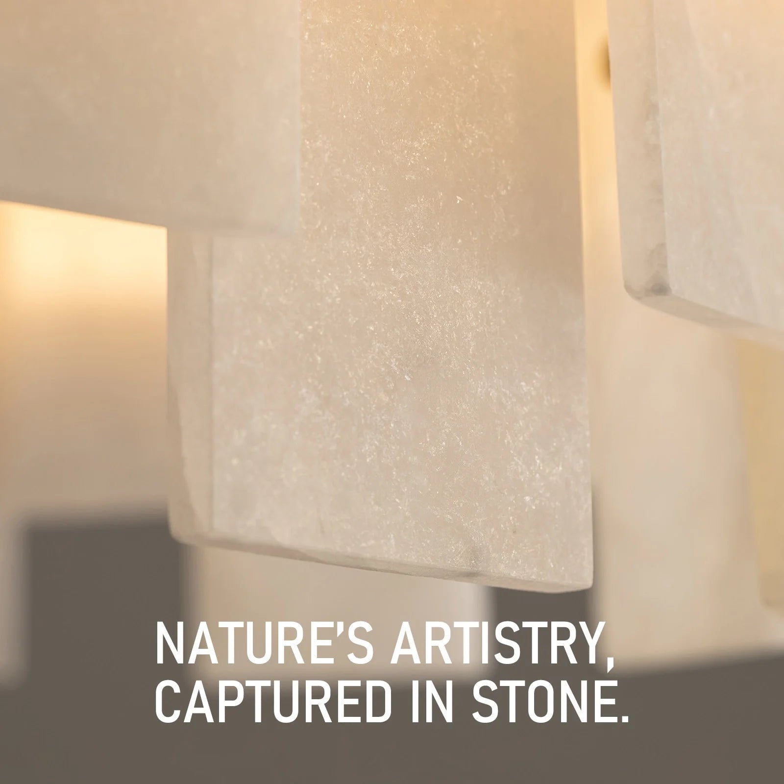 close-up-of-modern-round-alabaster-gold-chandelier-with-circular-gold-frame-and-evenly-spaced-alabaster-panels-emitting-warm-light-Feyran-lighting
