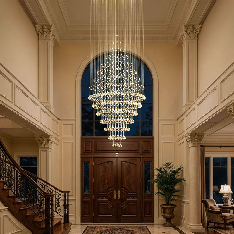 luxury modern round crystal chandelier staircase lighting fixture in high ceiling foyer entrance hall | Feyran