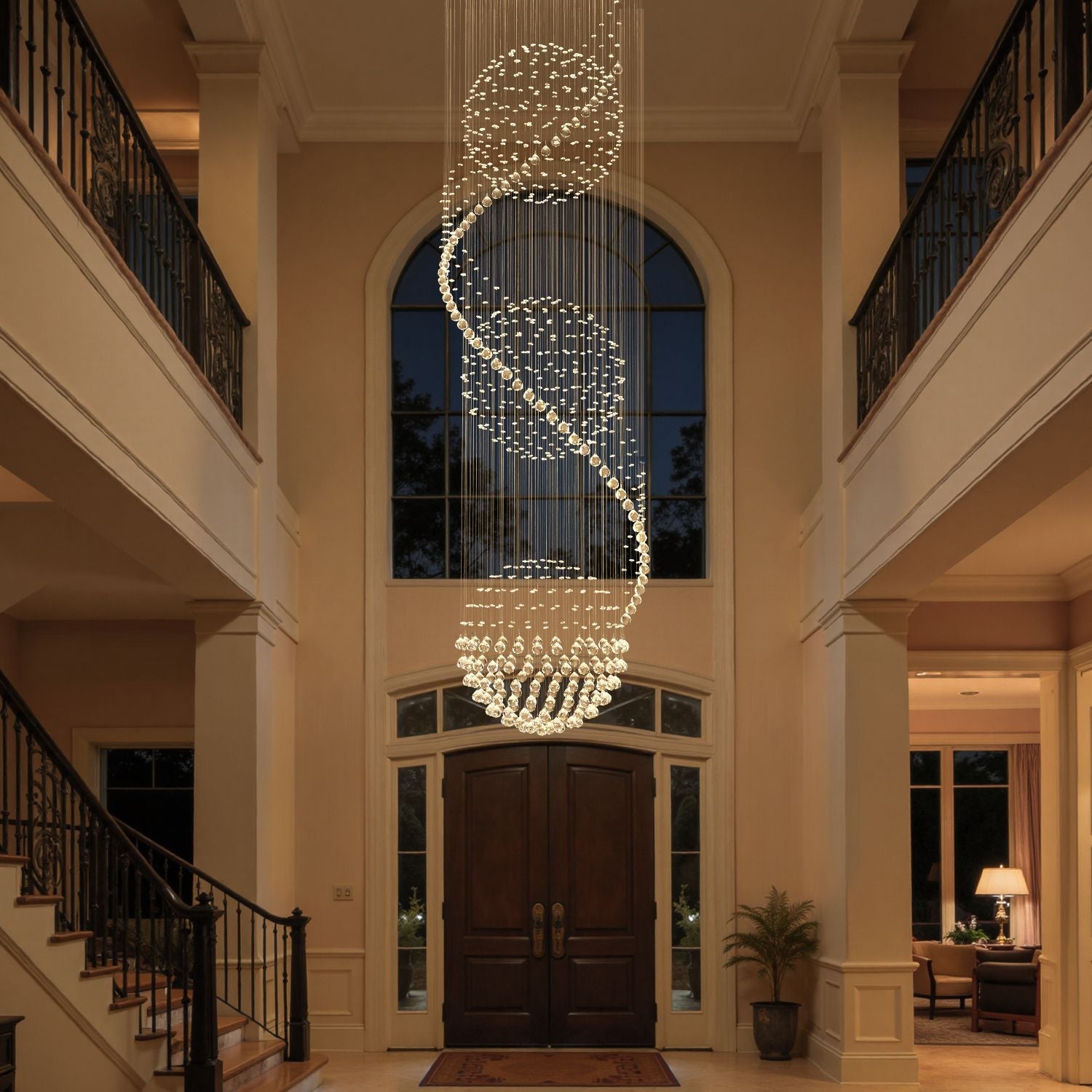 Spiral crystal chandelier featuring three sphere raindrop design in a grand entryway | Feyran