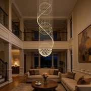 Three sphere raindrop crystal chandelier in a double height living room with staircase | Feyran